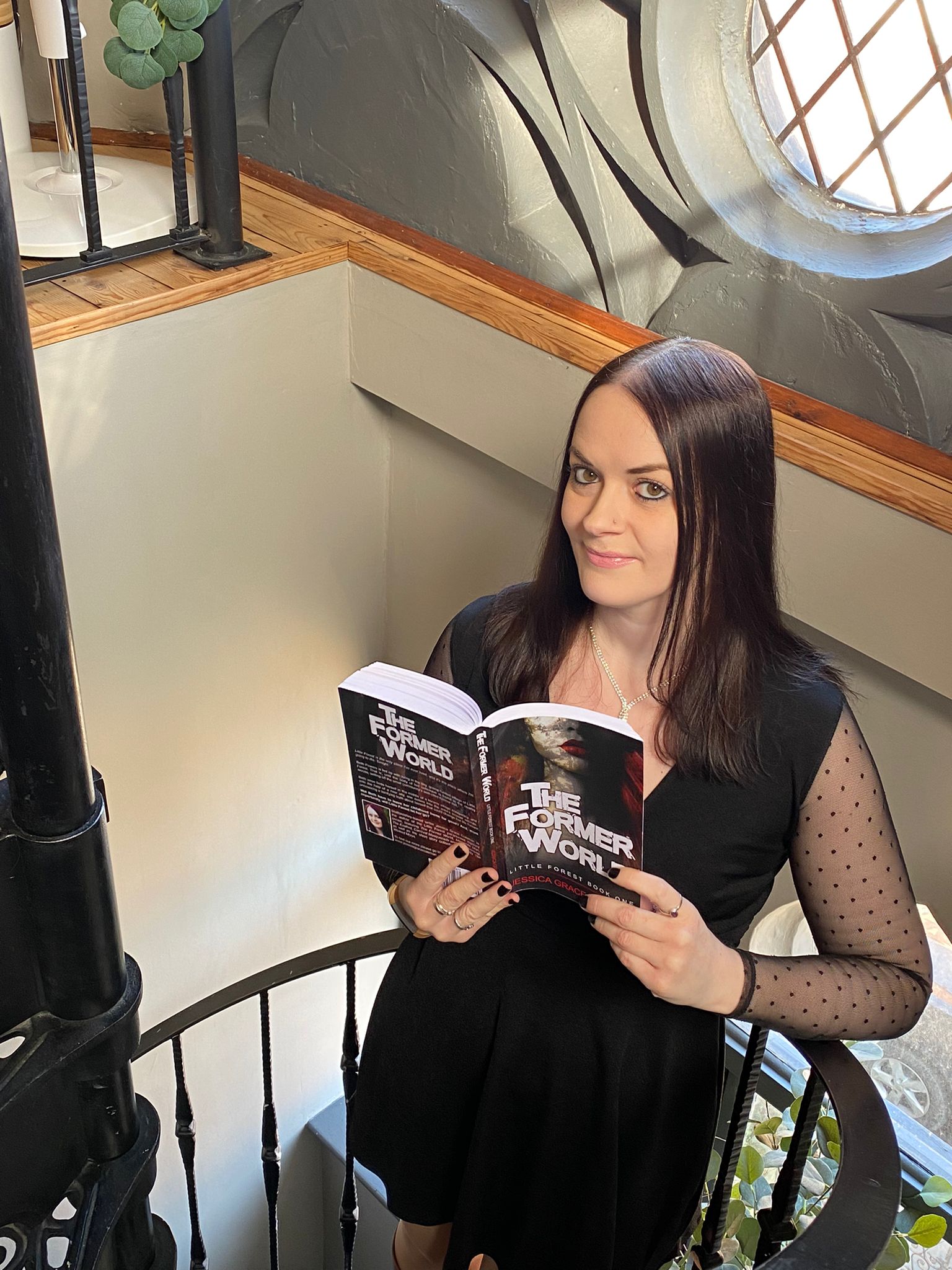 Jessica with her first novel, The Former World
