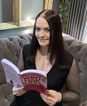 Jessica holding one of her published books